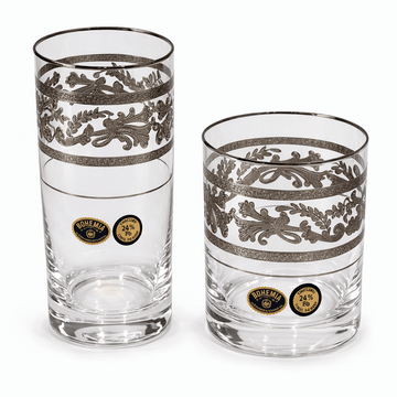 Two decorative glass tumblers with intricate designs and brand logos on a white background